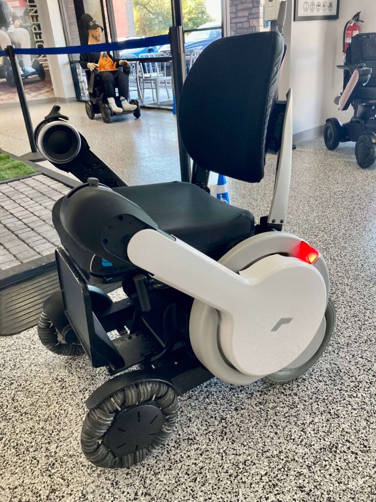 A motor wheel chair in black color