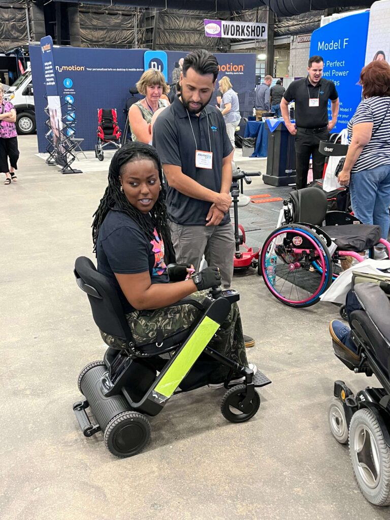 A woman at a wheel chair convention