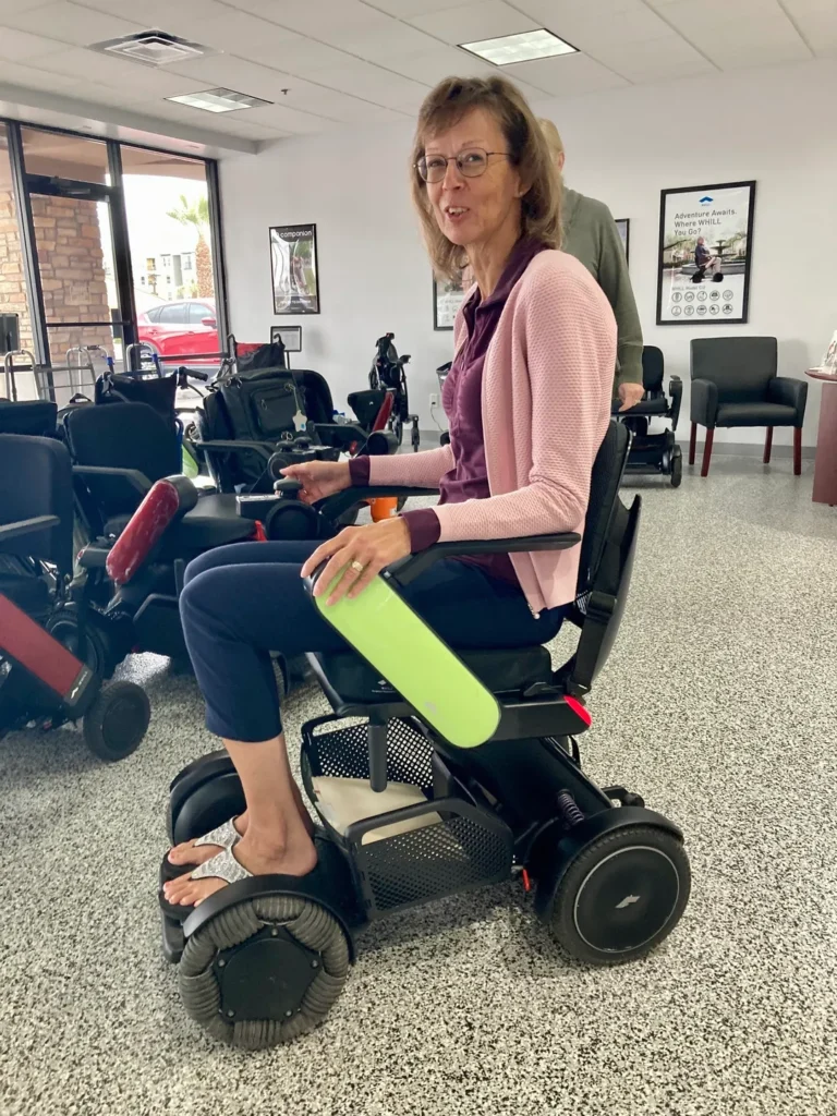 A senior woman using WHILL Mobility Device