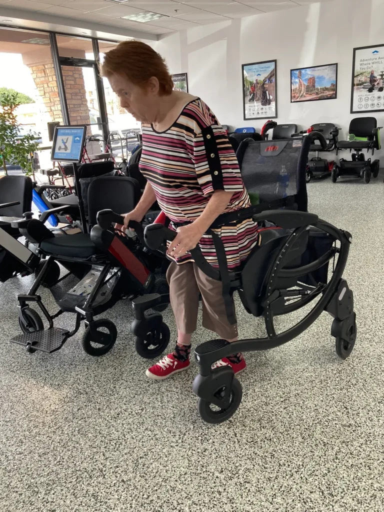 A woman using the WHILL Mobility Device