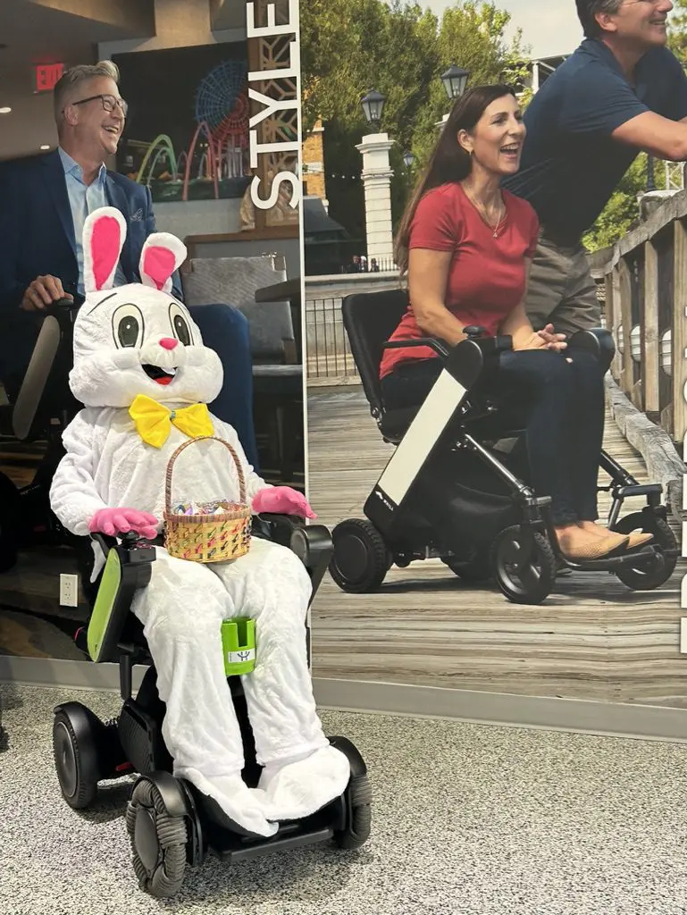 A person in costume using the WHILL Mobility Device