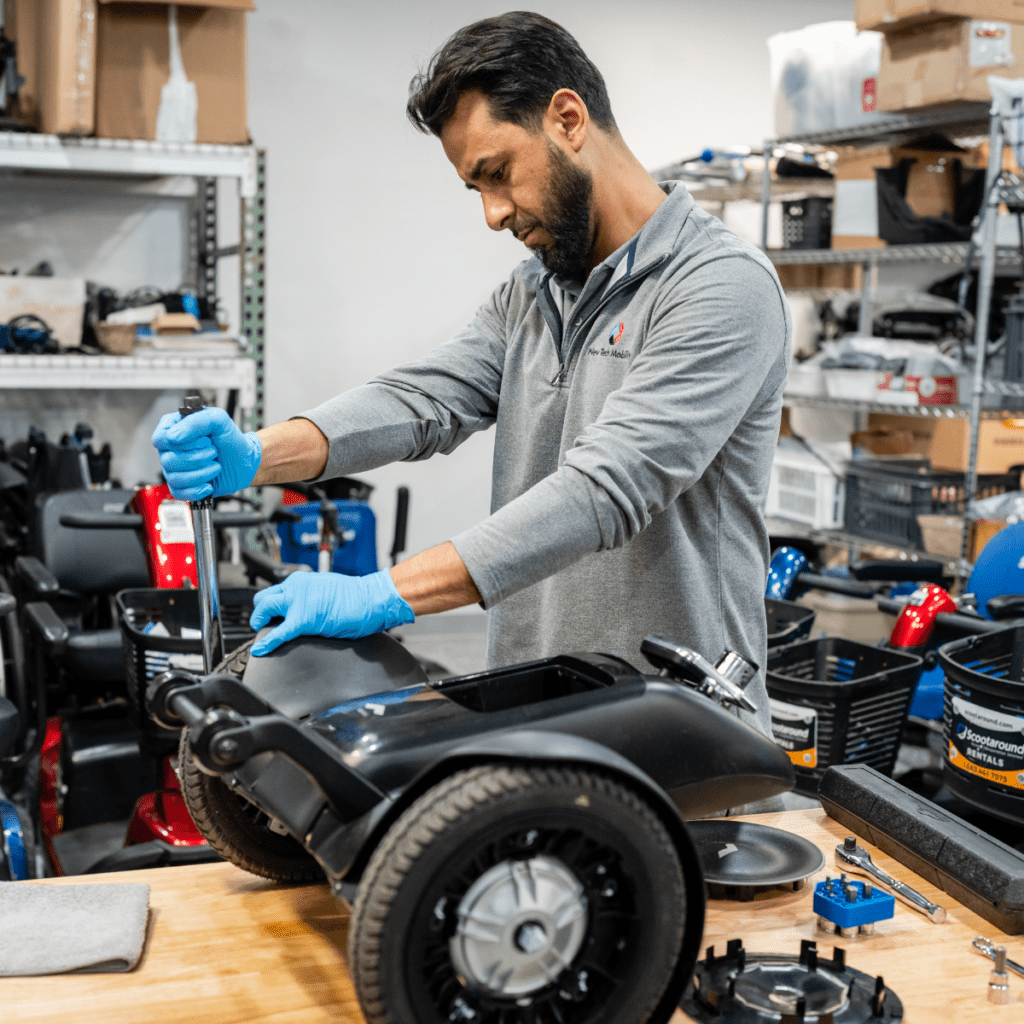A mechanic repairing the WHILL Mobility Device