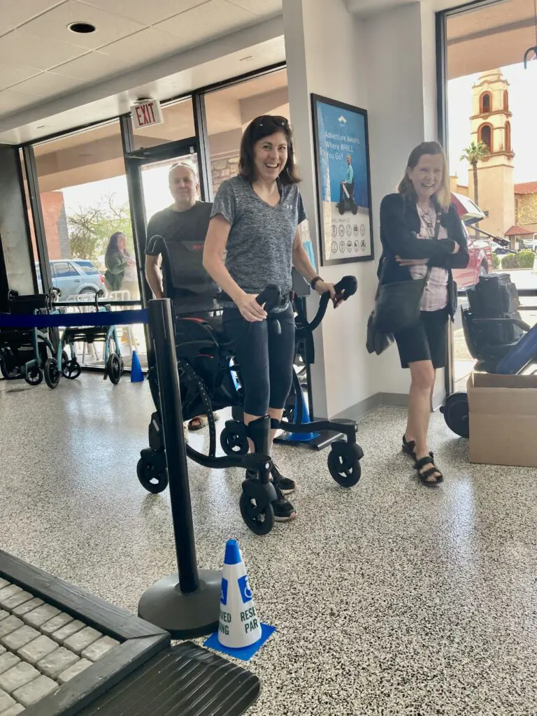 A group of people in wheelchairs walking through an airport.