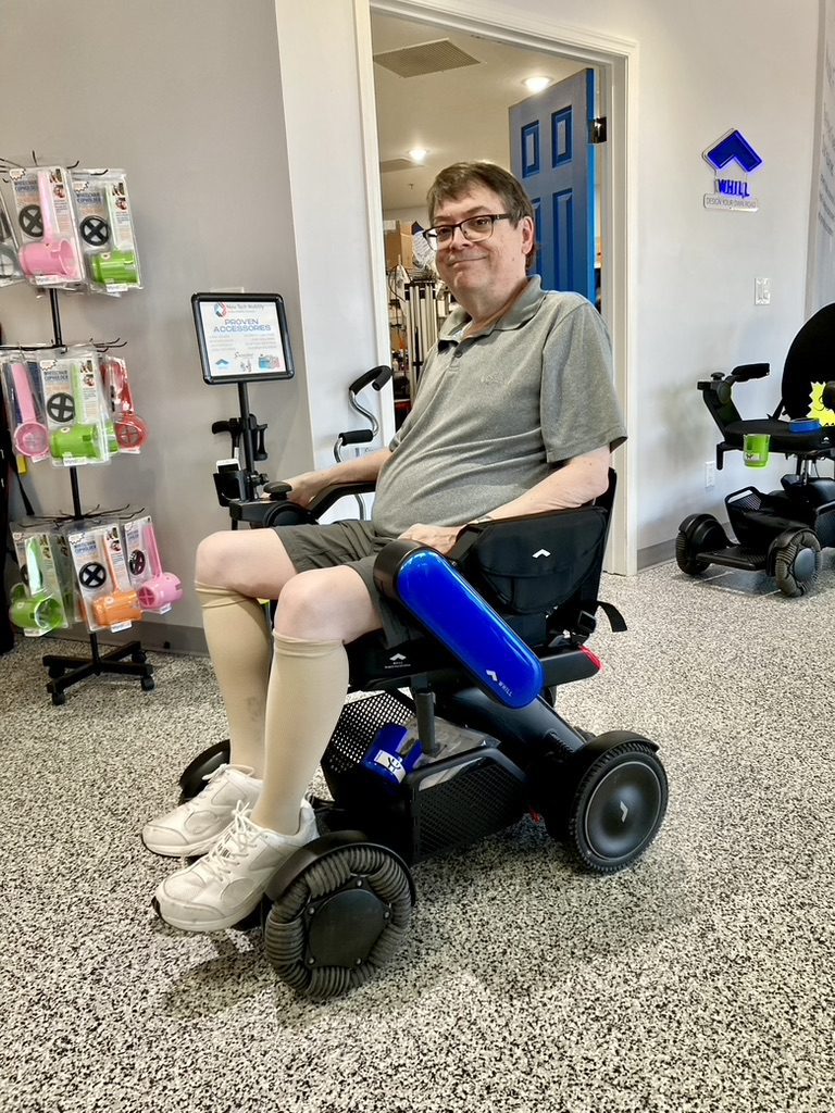 A man in a wheelchair in a store.