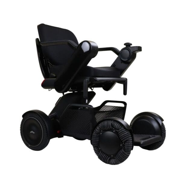 A black WHILL Model C2 with wheels and a seat.