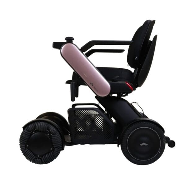 A pink and black WHILL Model C2 on a white background.
